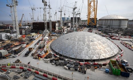 A photo of the Hinkley Point C Nuclear Power Station dome, highlighting the project's challenges with cost and timescale.